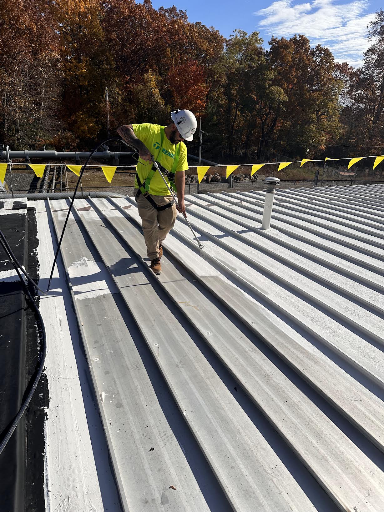 Tremco roof coating installation. JAG painting certified Tremco roof installer